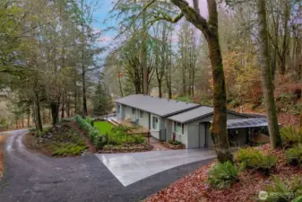 Nestled into a hill in a convenient Black Lake location, this one-story home is turn-key and ready for its next chapter.