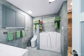 Primary bath is fully reimagined with pvc tiled walls for easy care and longevity, walk in, jetted tub and amazing shower