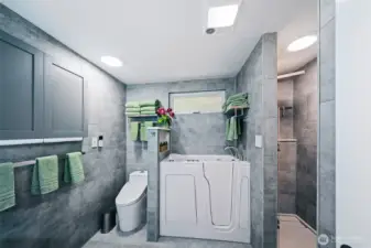 Clever design in the laundry, with a laundry tower, which allows space for a folding table, folding rack and more storage. Washer/dryer tower is included in the sale for a truly turn-key home