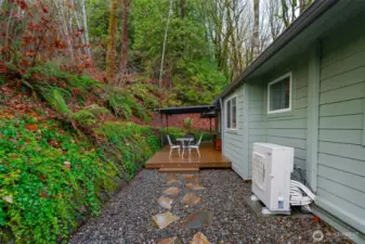Private and easy care rear deck area, tucked up against the hill and surrounded by nature