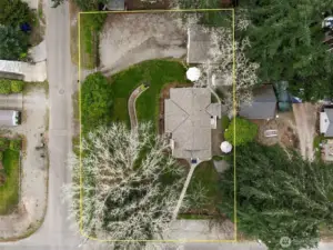 Situated on a fully fenced corner lot spanning over 1/3 acre, the property offers a private, park-like setting true to the charm found in this neighborhood.