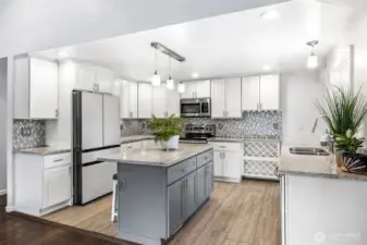 Stylish quartz countertops and SS appliances.