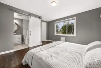 Primary bedroom suite on main with full bathroom and walk-in closet.