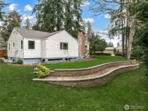 Private, park-like setting true to the charm found in this neighborhood, with mature heirloom trees and established rhododendron hedges.