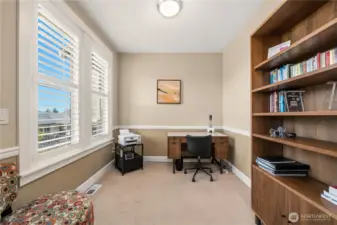 Office/Den with large windows and partial view