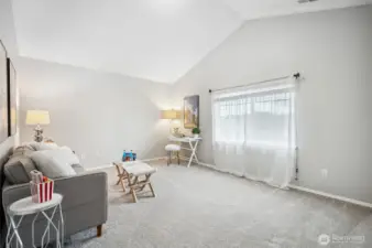 Rec/Media/Game room with closet and vaulted ceiling could be a large 5th bedroom.