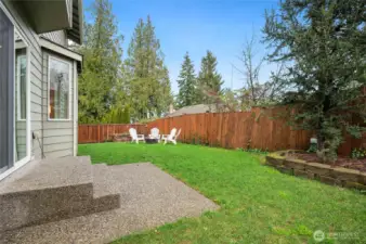 Fully fenced backyard offers added privacy.