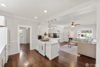 Kitchen and living room looking toward front entrance