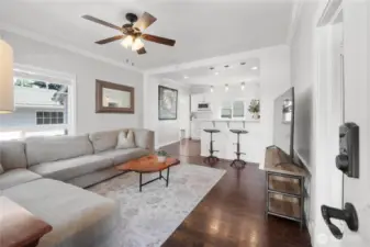 Through front door into Living room and kitchen
