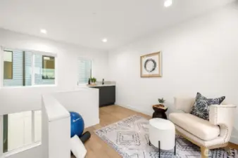 Step into the penthouse-level retreat with a built-in wet bar and wine fridge. Sunset views pour through the windows, inviting you to your expansive rooftop deck.