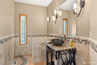 Guest bathroom near living and dining room.