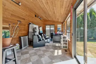 Great bonus space, currently being used as an in-home hair salon. Could be used for a number of things - sunroom, home gym, office... whatever your heart desires! Slider on the right leads to the fenced back yard.