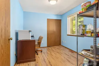 Front bedroom with french doors, currently being used as an office.
