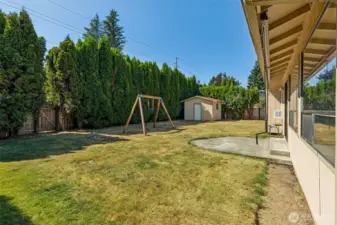 Lots of space in the back yard with privacy hedges. Shop in the back corner is more usable space!