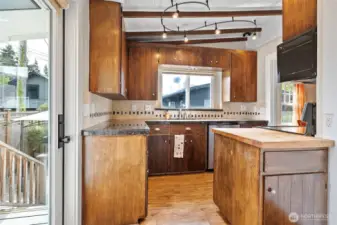 Kitchen door leads to fully fenced back yard