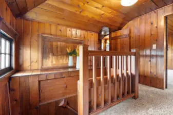 Upstairs landing with knotty pine paneling