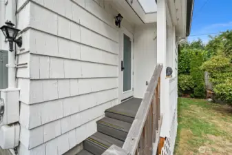 Door off kitchen leads to the fully fenced back yard