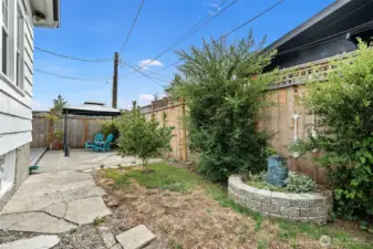 Fully fenced side yard with water feature