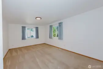 Huge primary suite with windows to the north and east