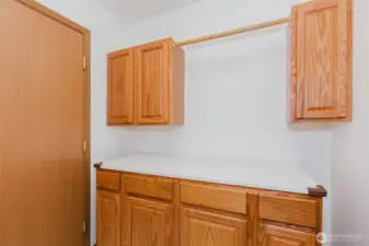 Extra storage and drying rod in laundry room