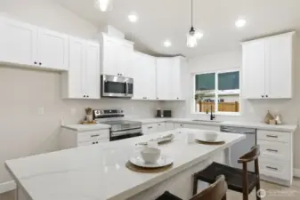 Modern kitchen with sleek finishes and stainless appliances.