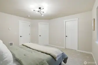 Relaxing primary bedroom retreat with walk-in closet and private ensuite