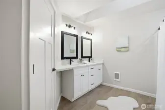 Primary bath with dual sinks and modern finishes