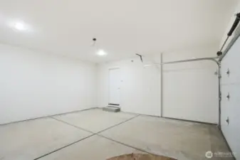 Spacious garage featuring 400 sq ft of versatile space and convenient garage door opener