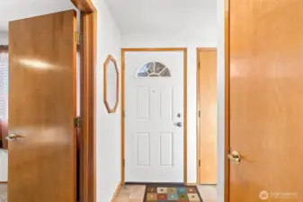 Welcoming entryway with an adjacent closet for added storage.