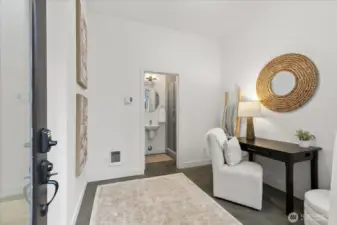 First floor living, with polished concrete surface, offers flex space for office, gym or additional storage for paddle boards, bikes, skis, etc.