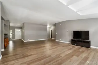 Massive family room with vaulted ceilings & skylights!