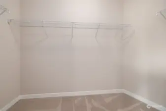 Walk-in closet off of primary bedroom