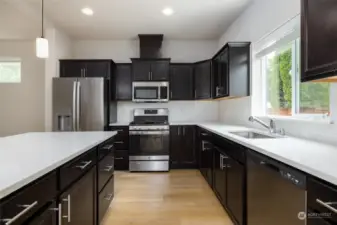 Kitchen has spacious island with eating bar.