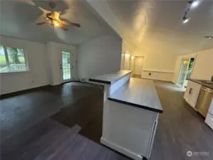 Kitchen view facing toward front and utility room