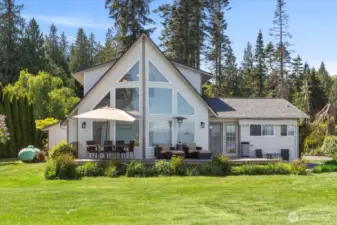 Impeccable floor to ceiling windows & multiple level decks