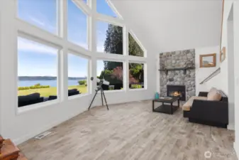 Living room w/cathedral ceiling & propane fireplace