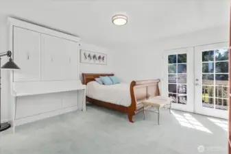 Primary bedroom facing private deck