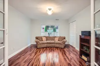 bedroom on main floor between garage entrance and stairs