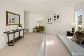 Primary bedroom with walk-in closet and en suite bath with tub.