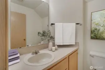 Convenient powder room on main level. This photo has been virtually staged.
