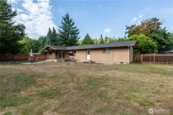 Enjoy summer evenings on the covered patio just off the French doors, perfect for outdoor dining or entertaining.