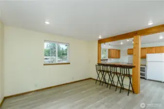 This inviting living space combines warmth and functionality with an open-concept design. The live edge wood counter top invites you to a warm space to enjoy meals, conversation and home.