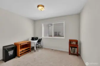 Dedicated office space with glass french doors located on the main level. Window faces south and fills the space with tons of light. New carpet just installed. Wood blinds cover the window for additional privacy.