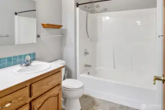 Full bath with tub/shower combination.