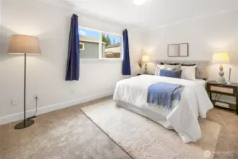 The spacious primary bedroom features an en-suite bath, providing privacy and everyday ease.