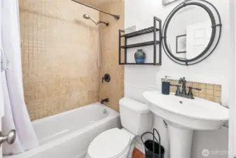 Convenient full bathroom serves the household with plenty of space and comfort.