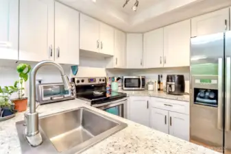Enjoy cooking with stainless steel appliances and soft close drawers