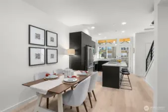 Gather and connect in the inviting dining area, where natural light and thoughtful design meet. This space complements the heart of the home beautifully. Photos of home with similar layout, finishes & fixtures.