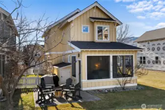 Screened veranda looks out at common greenspace.