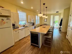 Island Kitchen has extended counters for an Eating bar.   Plus a wine fridge.